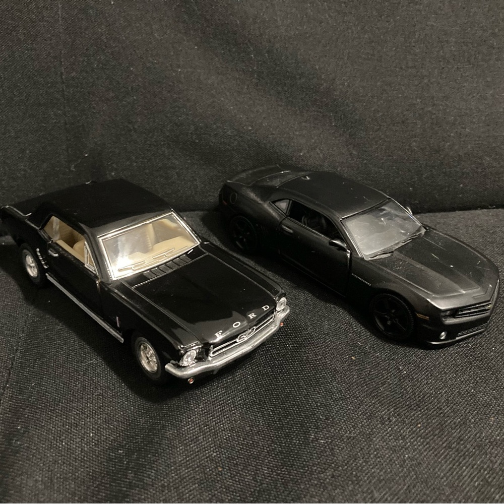 Black older mustang + New camero